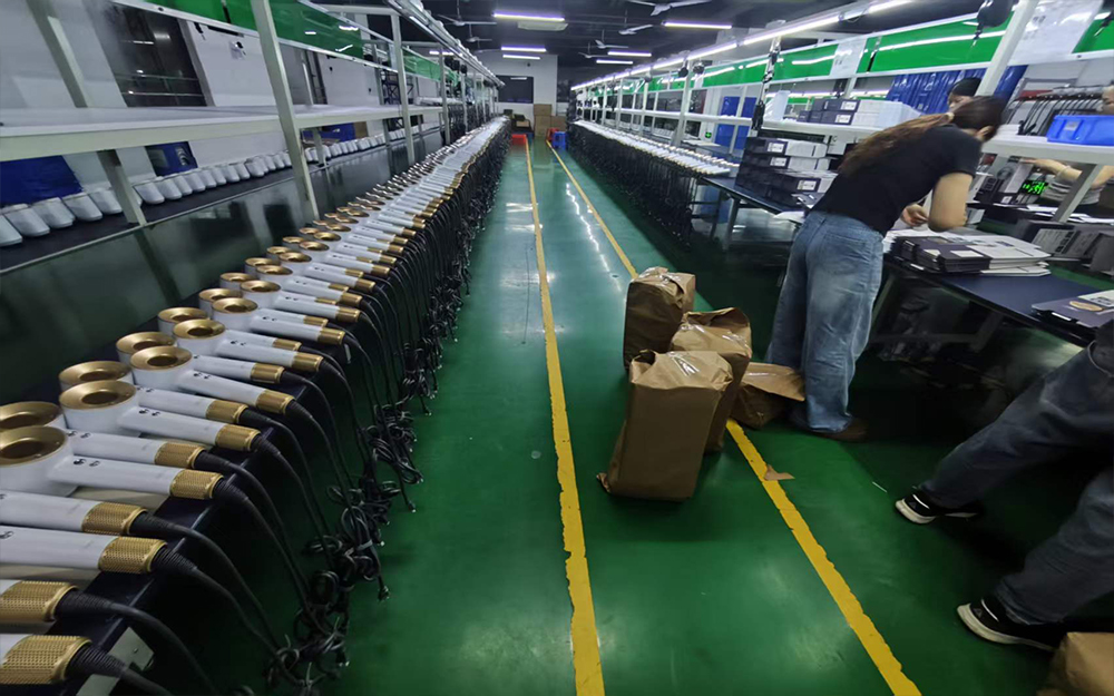 Quality control team inspecting high-speed hair dryers during production.jpg